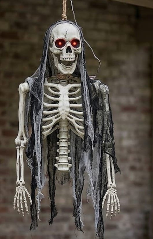 DECORATION, HANGING, HALF SKELETON, W/ RED LIGHT UP EYES